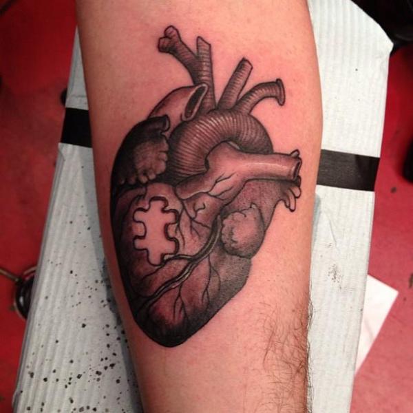 Coeur puzzle tatouage